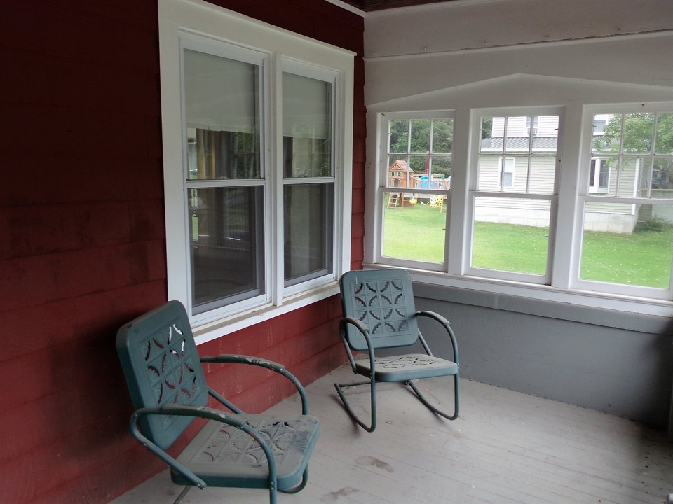 semi enclosed front porch block out the wind and keep the evening nights.