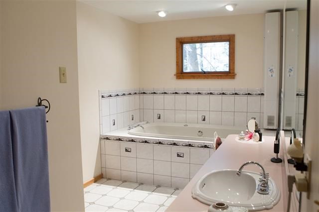 master bath with a spa like feel this bathing area will bring you peace of mind.