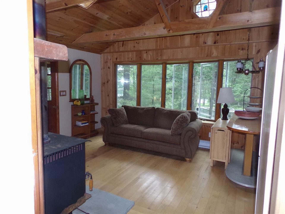 cool and green in summer, warm and cozy in winter. cozy woodstove to take away the chill is the back wall focal point.