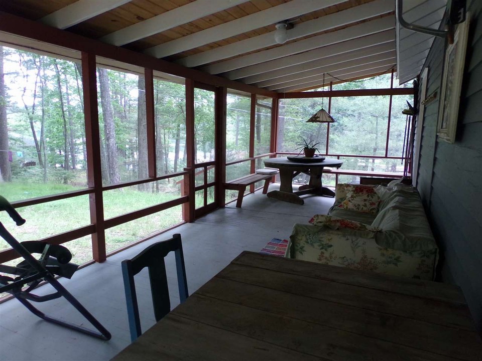 room to grow a three season view of the lake keeps the elements of nature at bay.