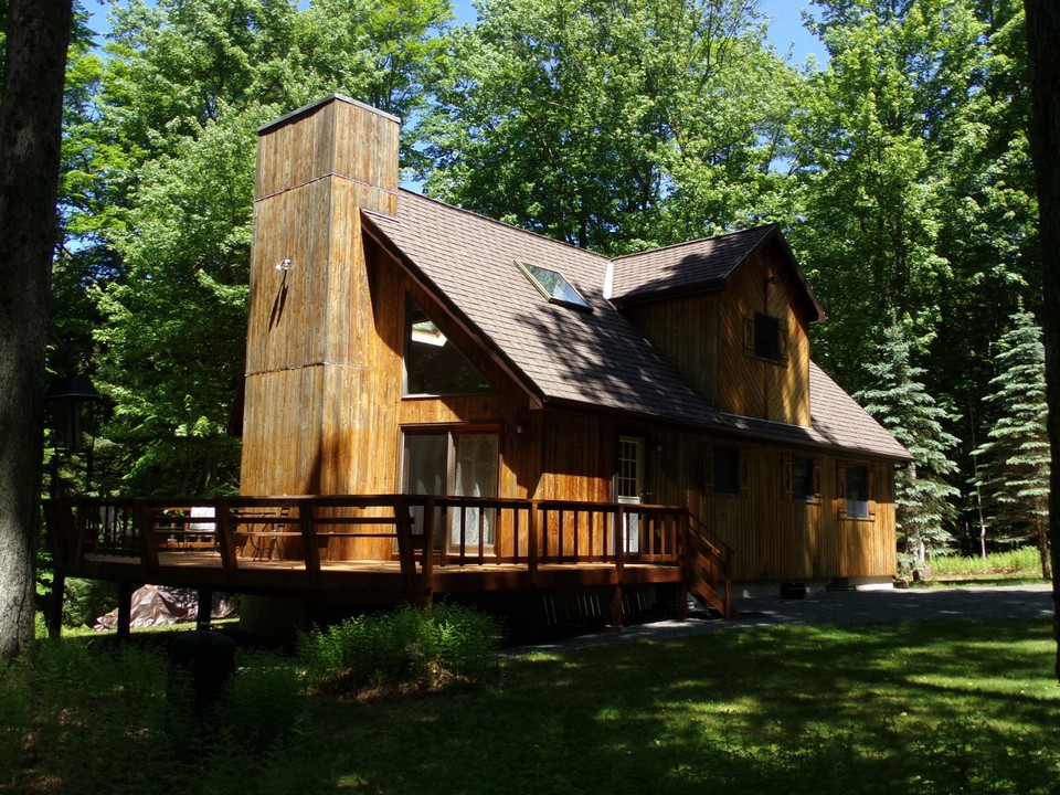 private, secluded and peaceful cedar exterior blends with the landscape.