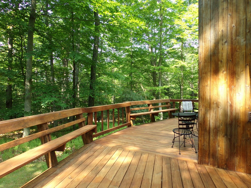 extended outdoor living space guests will love being out under the hardwood tree's!