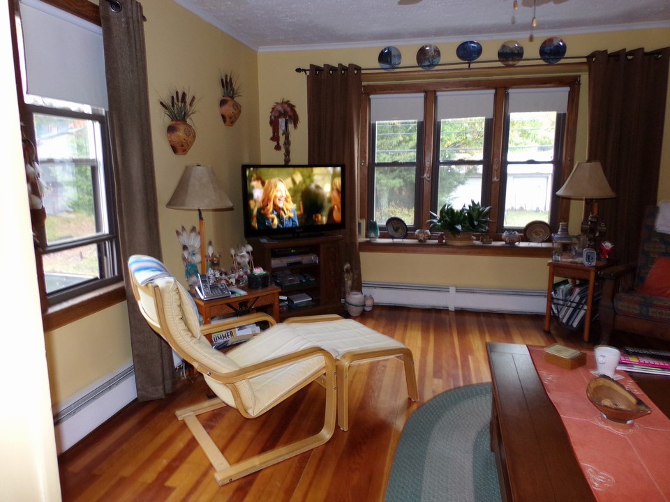 apartment 1 livingroom area old time flooring adds to the warmth of this special family meeting area.