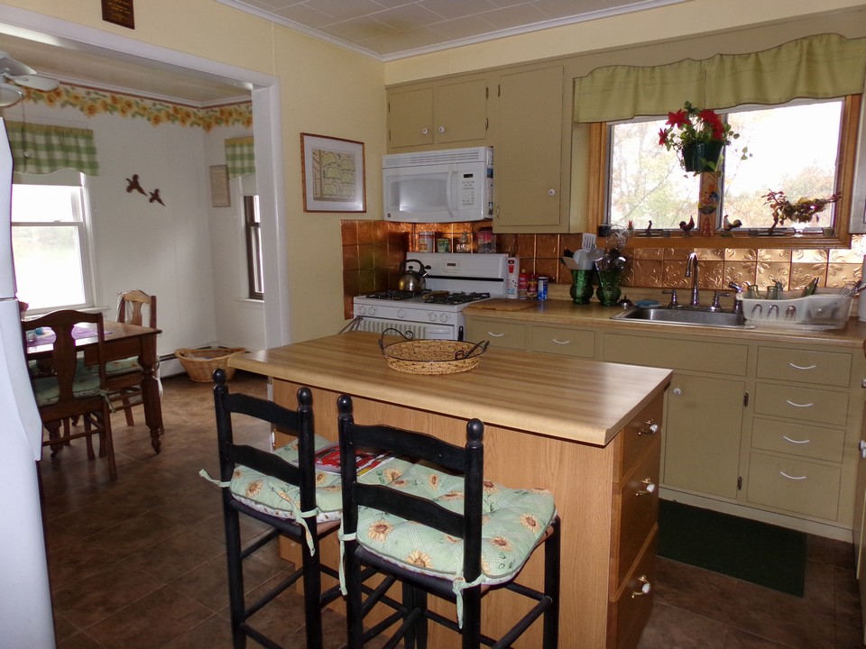 kitchen island country kitchen island and coffee time nook overlooks the lake.
