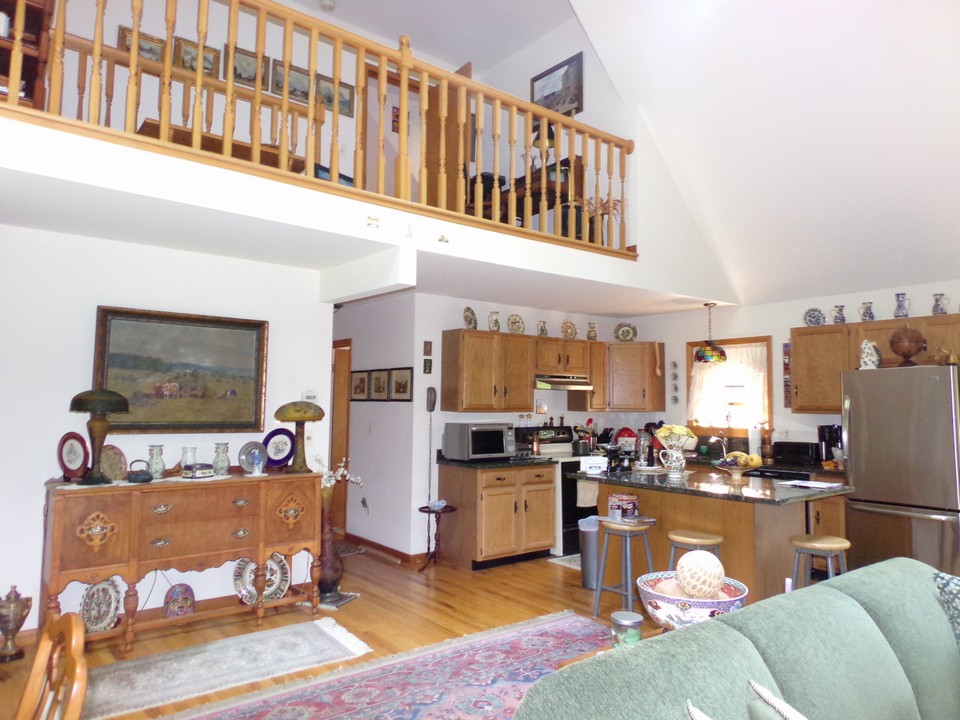 kitchen area  granite counter tops and workman's center isle