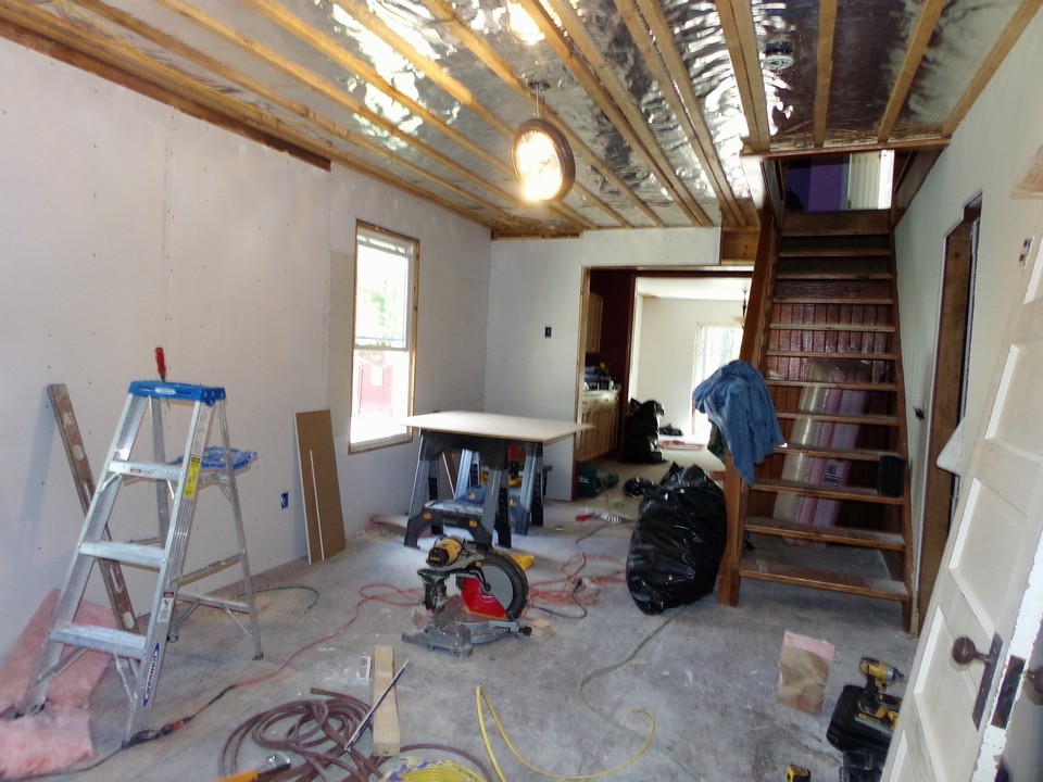 the stair way which was a back in the day  focal point was almost hidden under years of home owner accumulated items.

fresh wiring , plumbing and insulation was needed to bring this aging master piece back to todays standards.