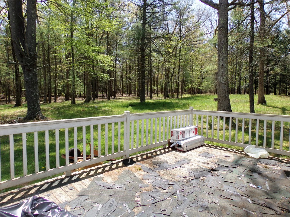 the oversized deck was finished and needed to be repaired and replaced.