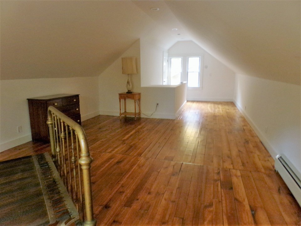 upstairs loft space doubles as a bedroom or an extra large den area.