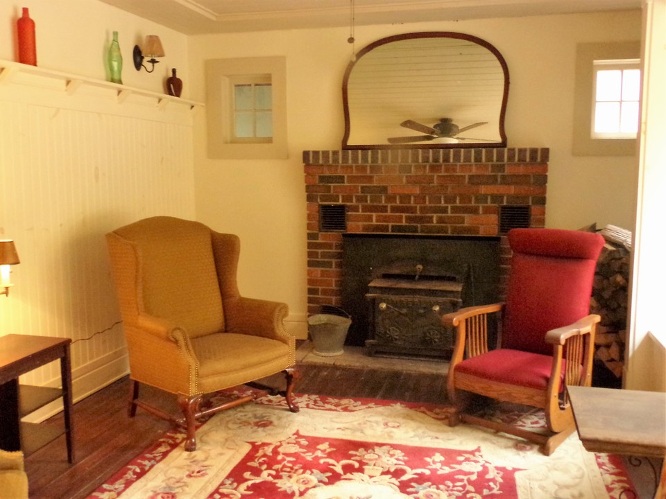 cozy quiet times working wood burning brick fireplace has a woodstove insert to extend the warmth of this 4 seasoned home.