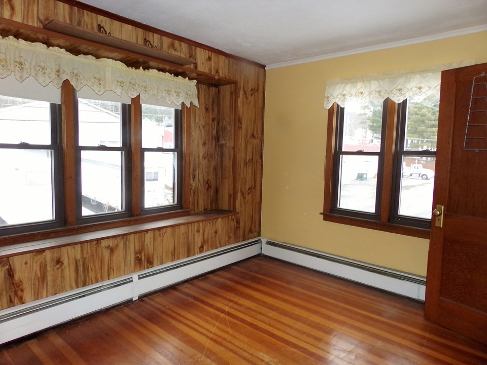 living room warm tones for winter nights. easy to maintain wood floors and plenty of sunshine through the expansive windows.