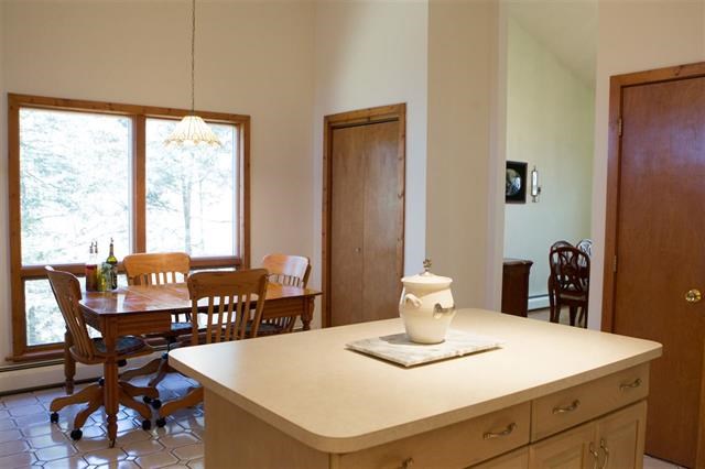 kitchen island time eat in kitchen for that family chef. plenty of room to create memories of a lifetime. bring the outdoors inside with expansive windows that look over the brook.